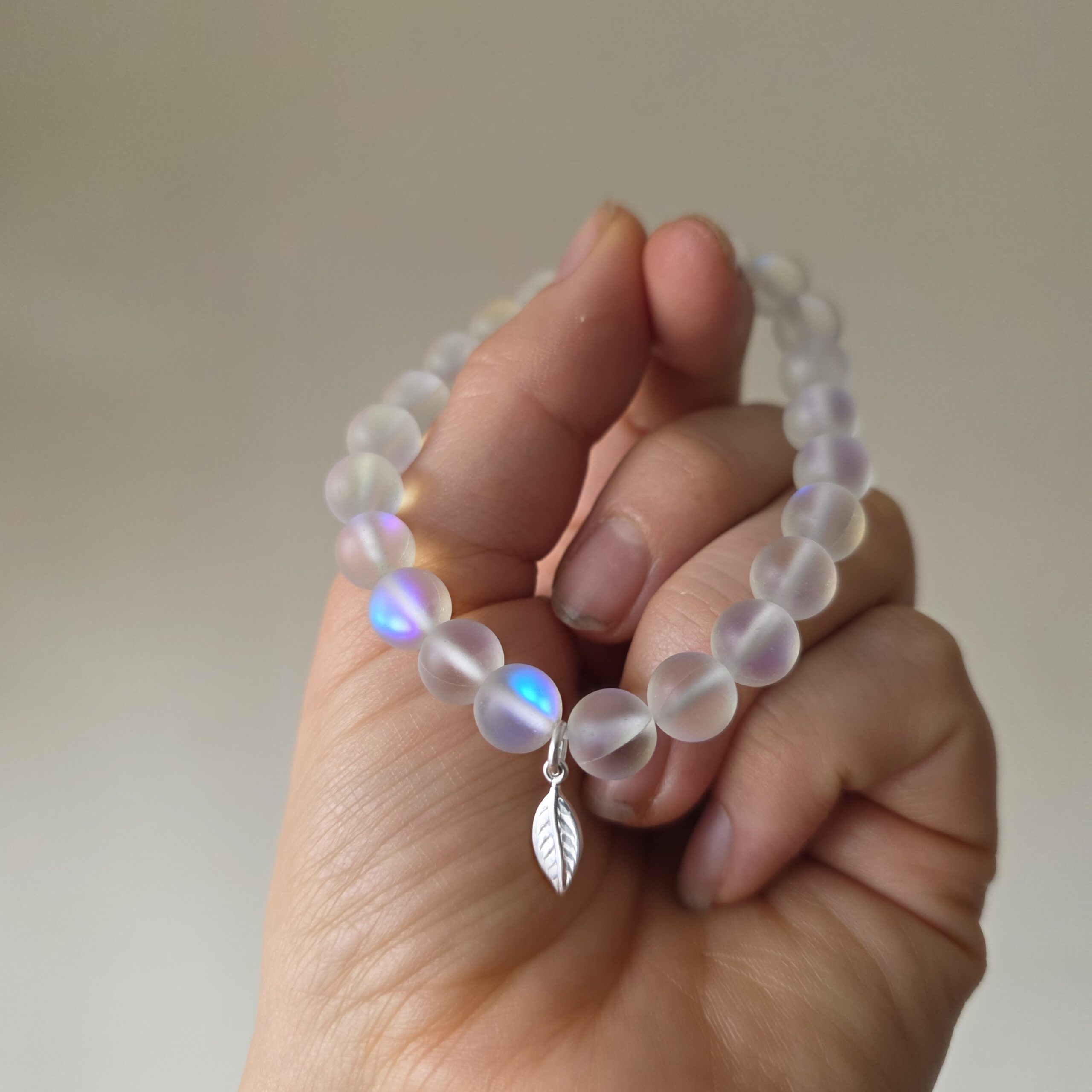 Iridescent Rainbow Aura Quartz Stretchy Bracelet with Tiny Sterling Silver Feather - Image 3