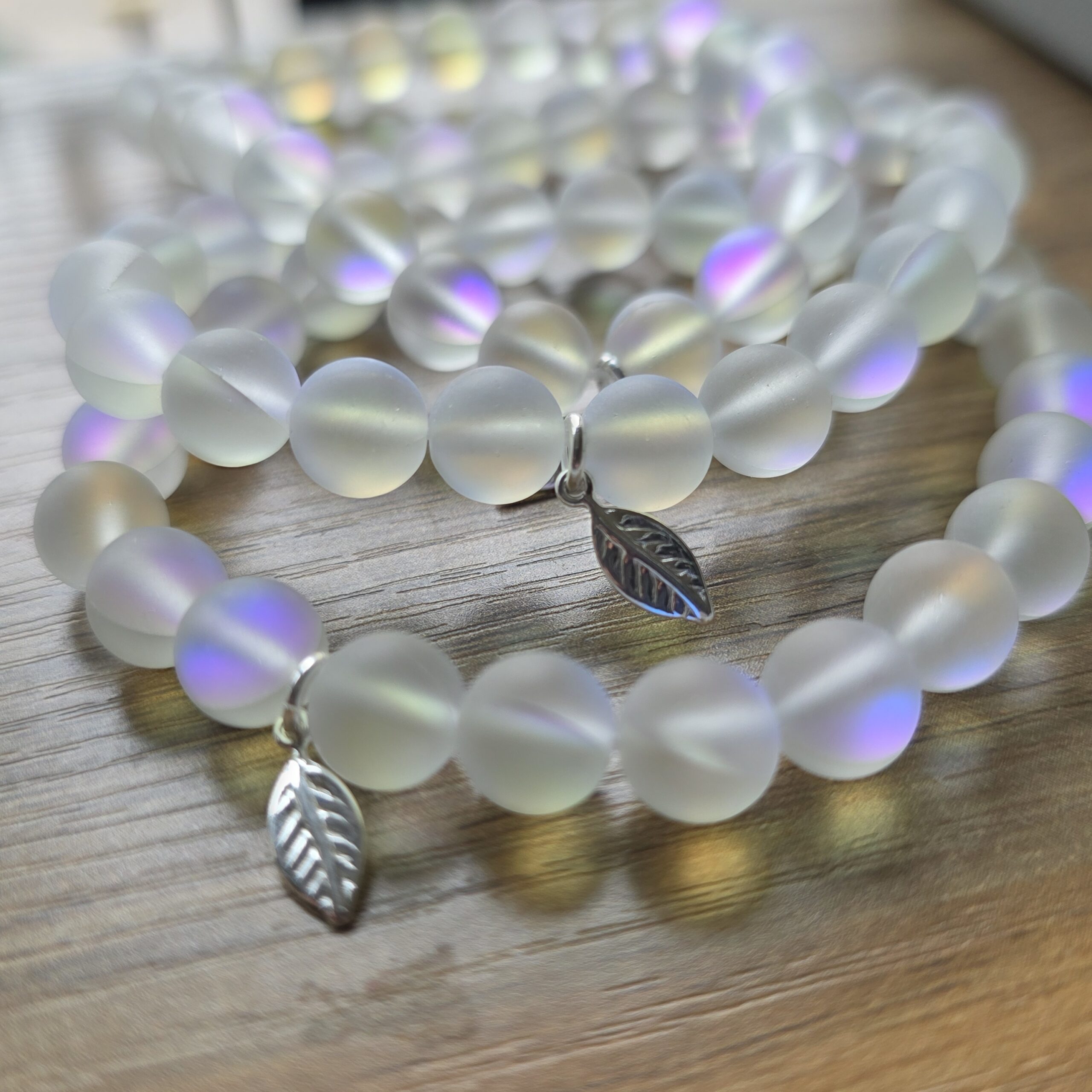 Iridescent Rainbow Aura Quartz Stretchy Bracelet with Tiny Sterling Silver Feather - Image 4